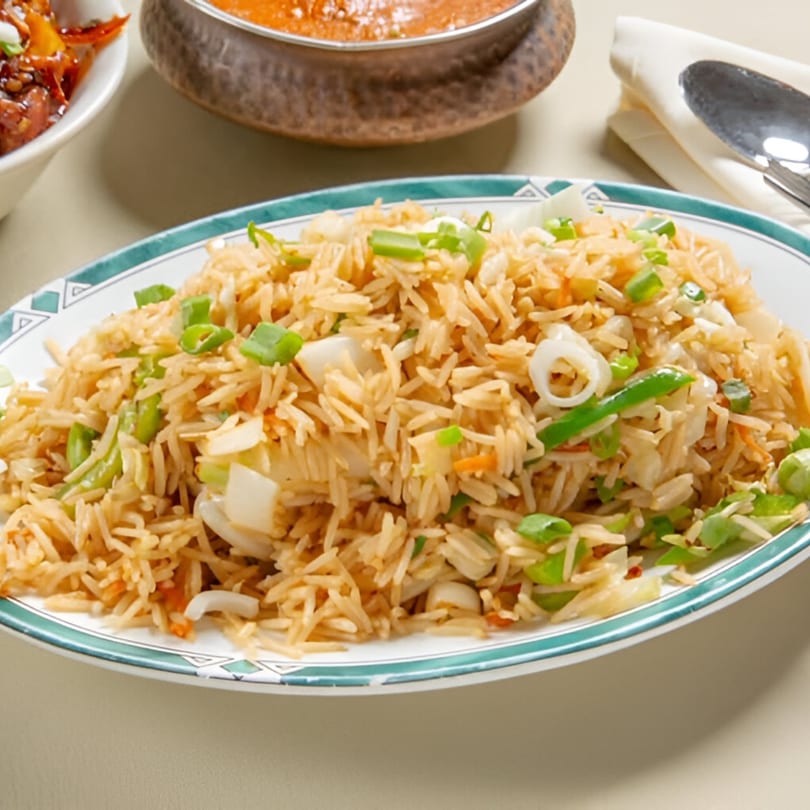 Nanking Indian Restaurant's vegetable fried rice with green onions, bell peppers, and carrots.