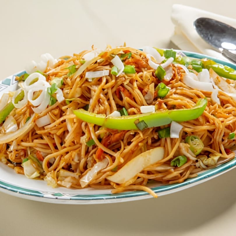 Nanking Indian Restaurant's Hakka Noodles, a flavorful Indian-Chinese dish with noodles, vegetables, and spices.